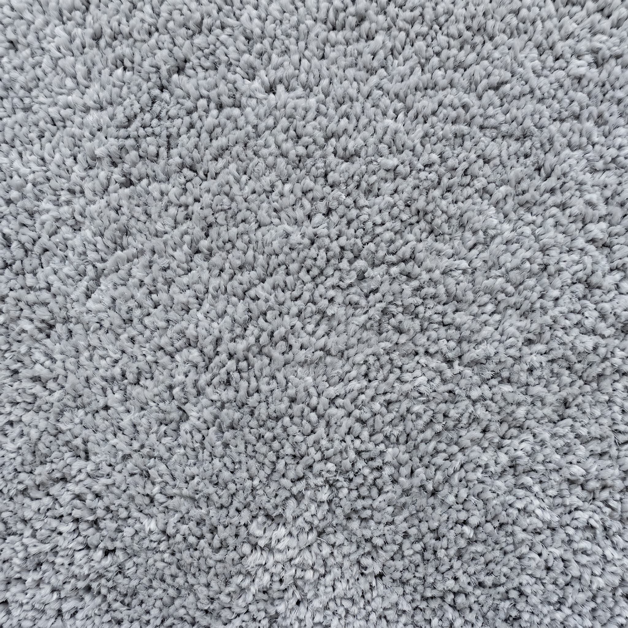 Plush light gray cut-pile carpet swatch