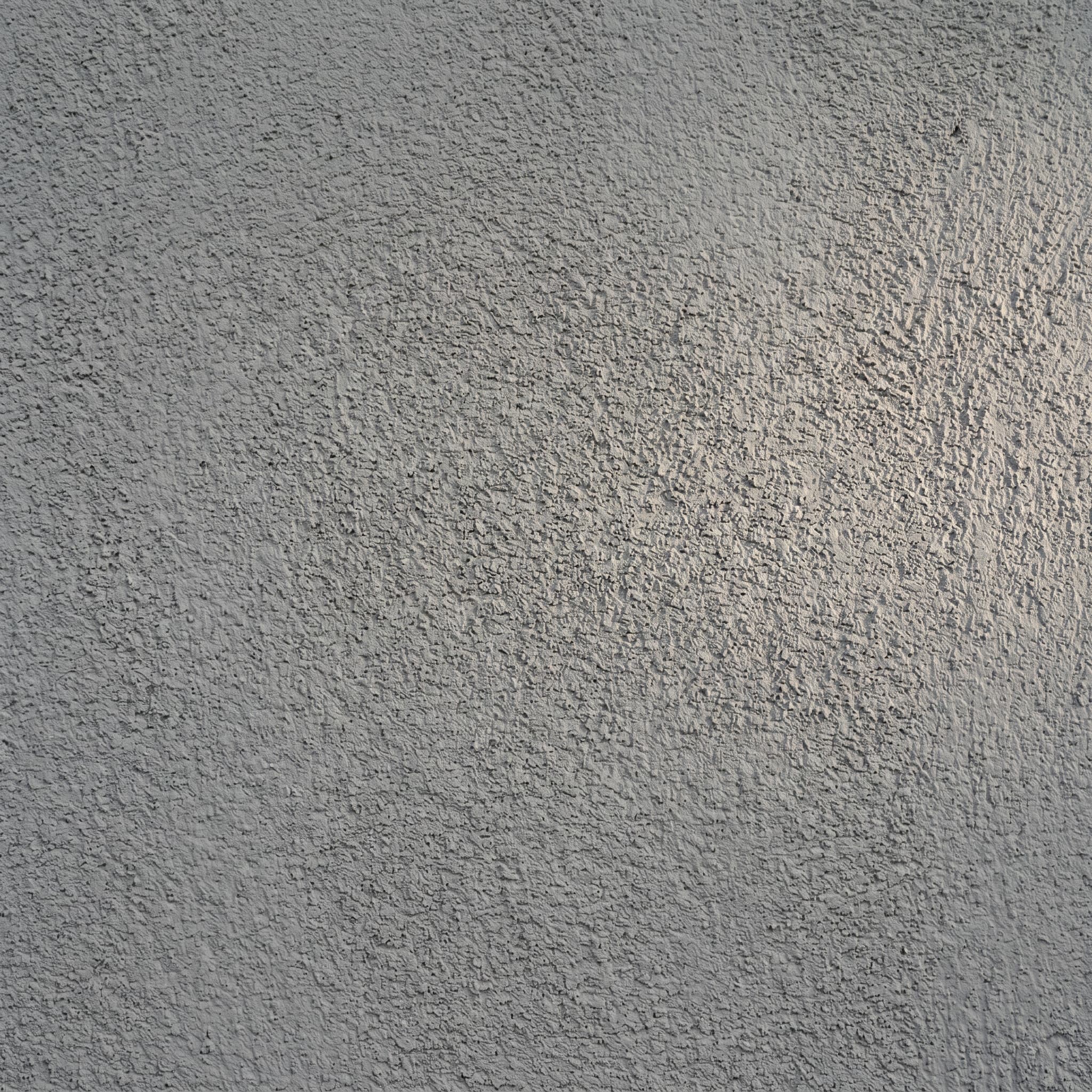 Smooth medium gray stucco exterior wall swatch