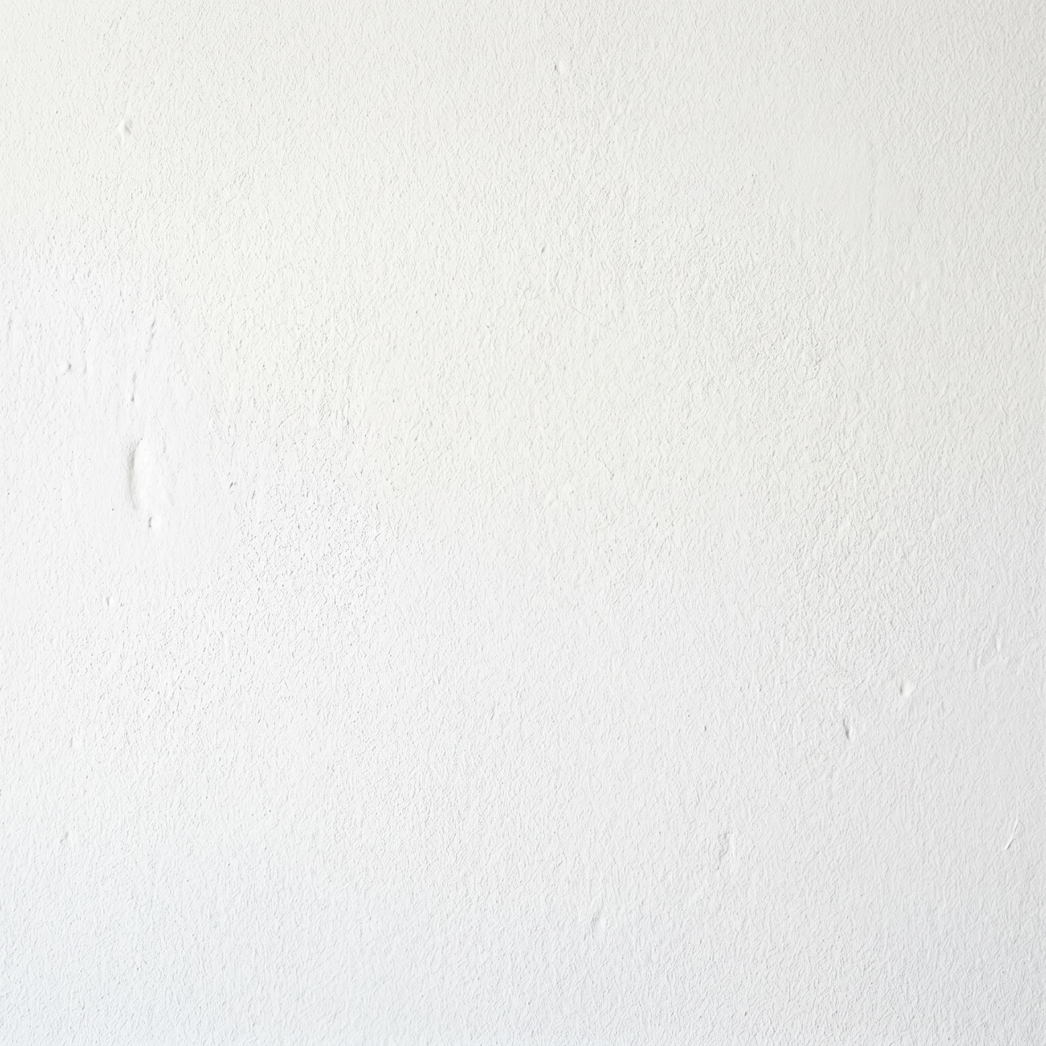 Sherwin-Williams flat white interior paint swatch on plaster wall