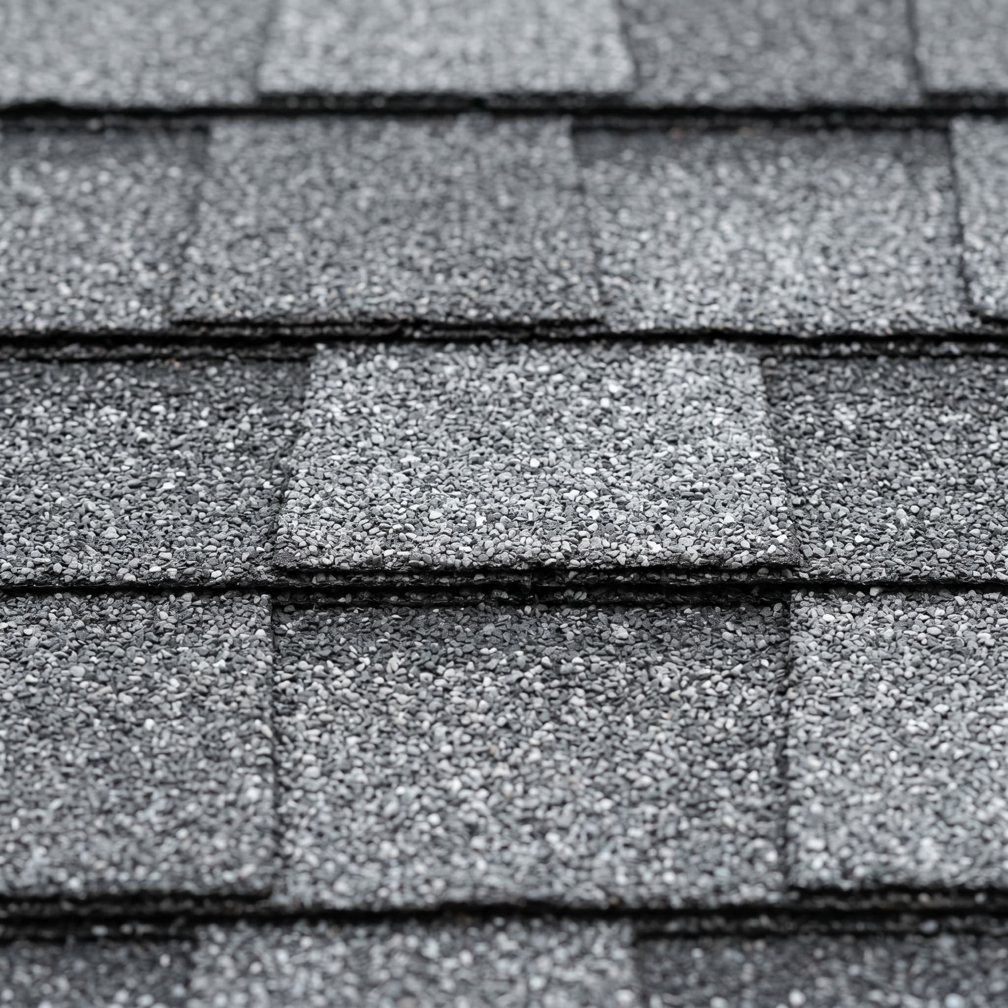 Medium gray architectural asphalt shingles with lighter silver granule variation