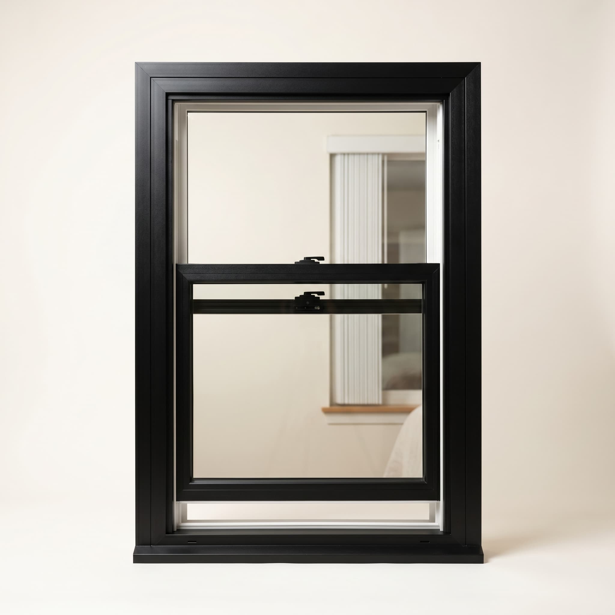 Single-hung matte black vinyl window with two glass sashes